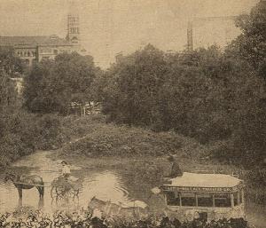 Omnibus soaking its wheels in the SA river